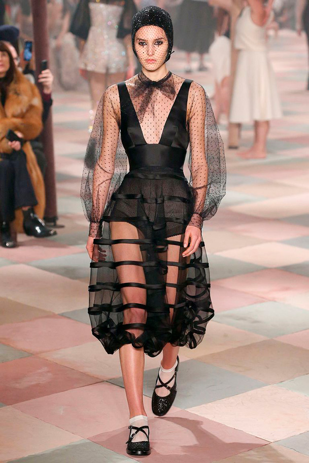 Dior couture with a sheer polka dot sleeve