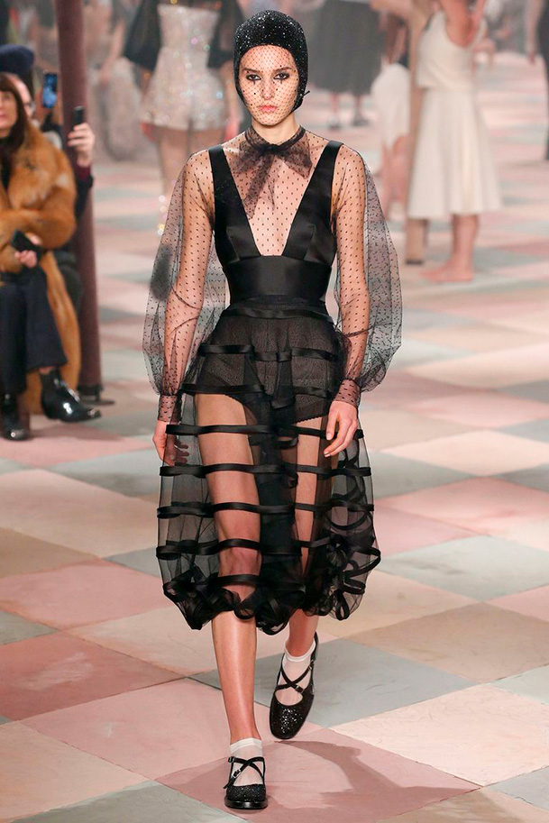 Dior couture with a sheer polka dot sleeve