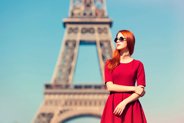 Woman in red dress in Paris - Julie Goodwin Couture Melbourne